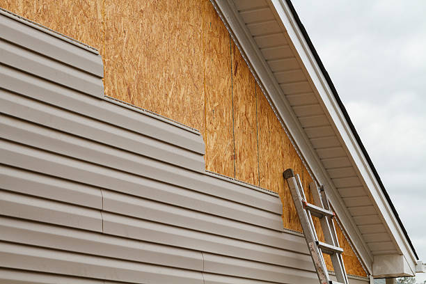 Professional Storm Damage Siding Repair technician working in Midvale, OH